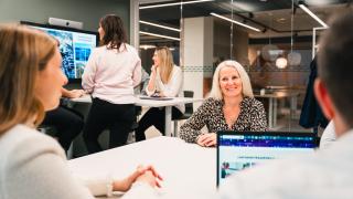 Photo of a coworking office space with a team of people working.